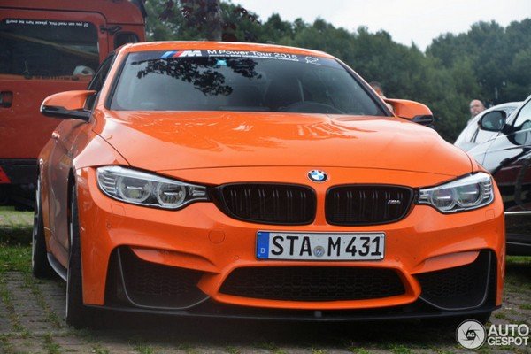 Car in orange colour front look