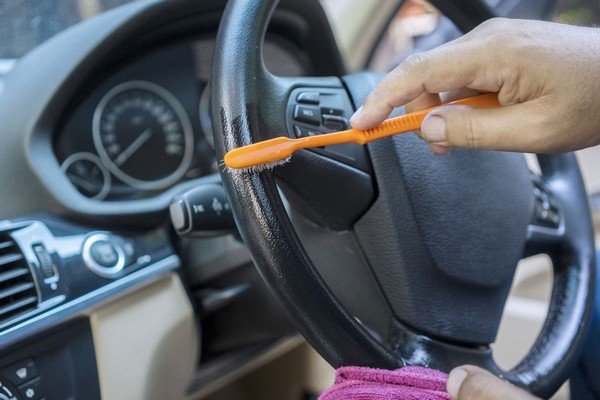 keep car interior clean with tooth brush