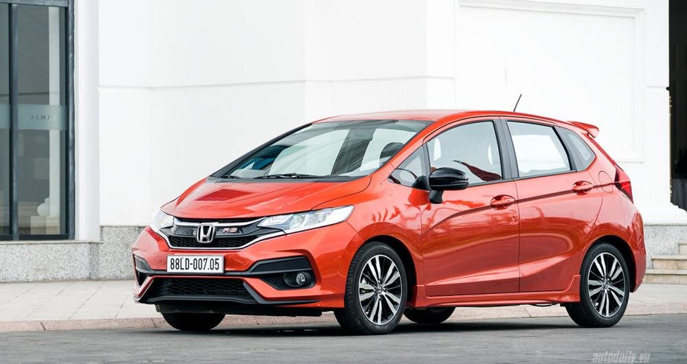 Honda Jazz 2018 red colour park on road front look