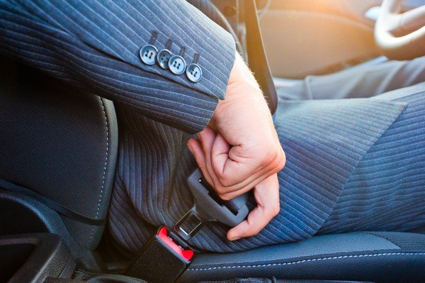 men wearing seatbelts 