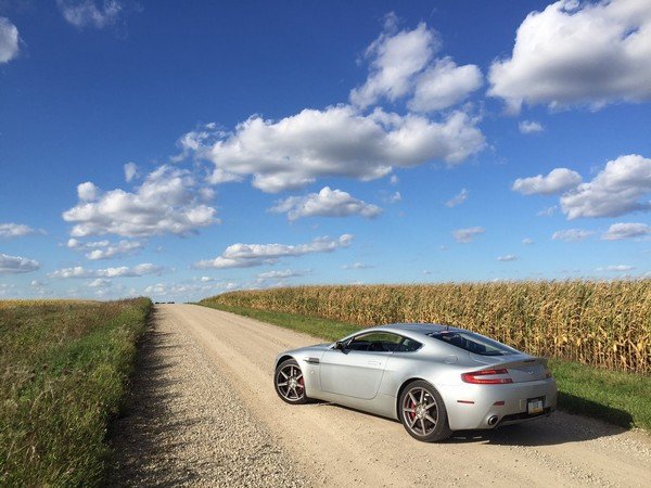  A silver car in the middle of nowhere angle view