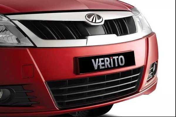 Red Mahindra verito’s left angular sideways front view of bumper and fog lights