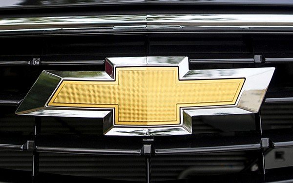 Chevrolet yellow silver logo with name in dark grey