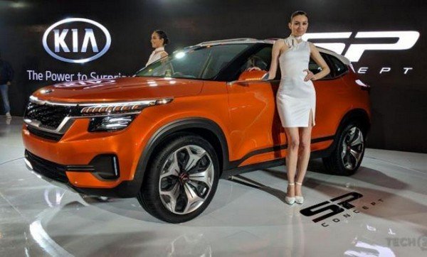 Kia showroom orange car with 2 models