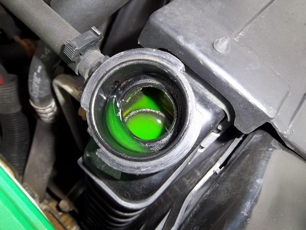 Green coolant inside a coolant reservoir