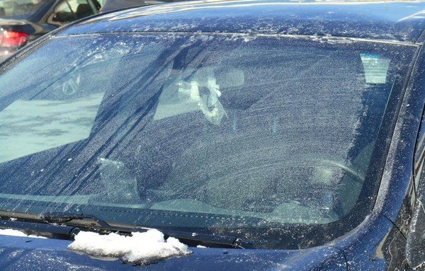 A car with frozen washer fluid on windshield