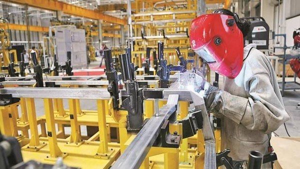 A worker working in an EV factory