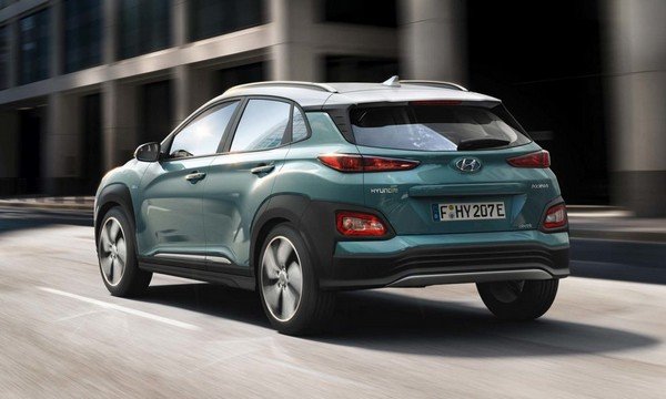 Hyundai Kona EV dark green colour angular look blurred background nature