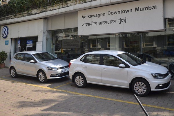 picture of 2 cars parking on road with Volkswagen Downtown Mumbai aside