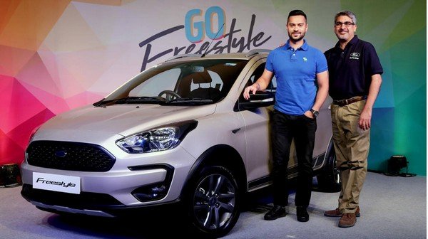 Ford Freestyle at showroom front look with two man