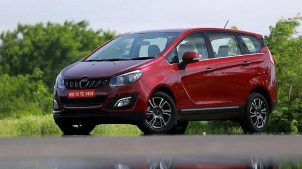 Mahindra Marazzo MPV red color right to left tree background