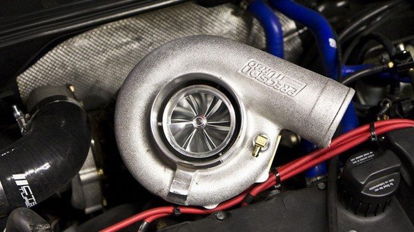 silver turbocharger under car hood