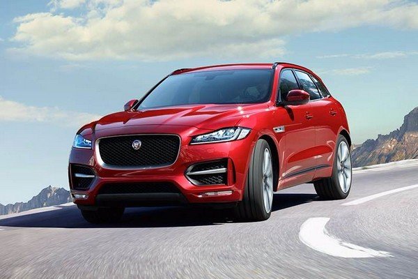 Jaguar F-Pace red color running on road