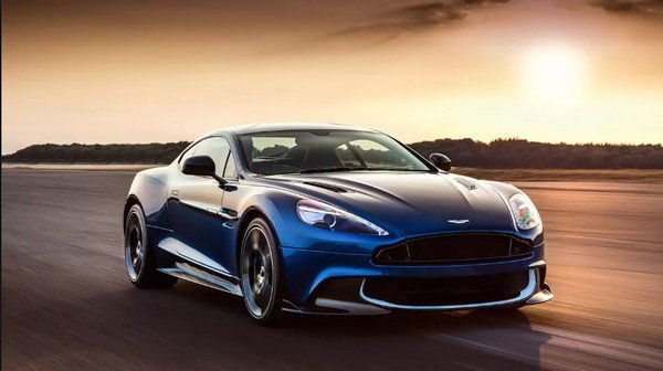 Aston Martin blue color car running on road