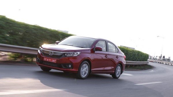 Honda AMaze red color front look on road