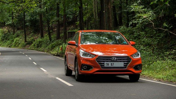 Hyundai Verna red color on road 