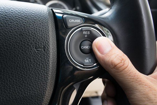 cruise control button on steering wheel