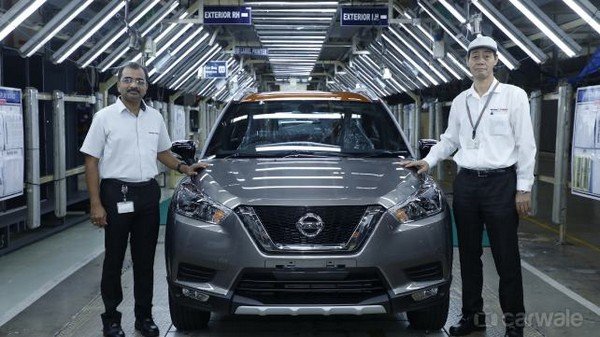 India-spec Nissan Kicks roll-off with two men sitting aside