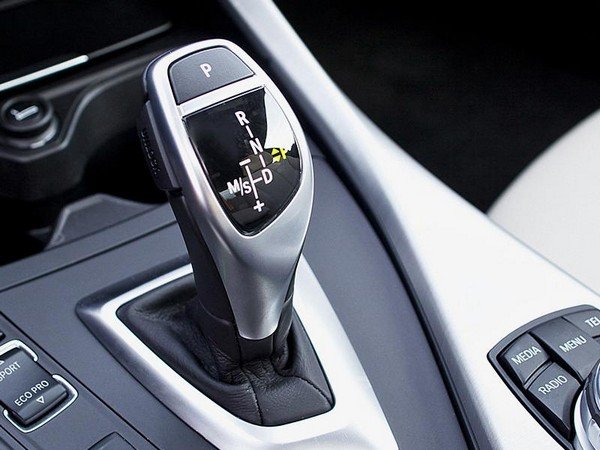 An automatic car’s gear shift with some details on it