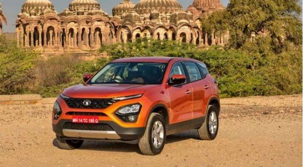 Tata Harrier orange color parking with temple background