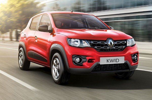 red Renault car running on road