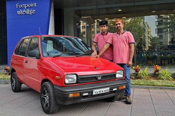 Mr V Murali and his son stand with 1991 Maruti 800 DX 