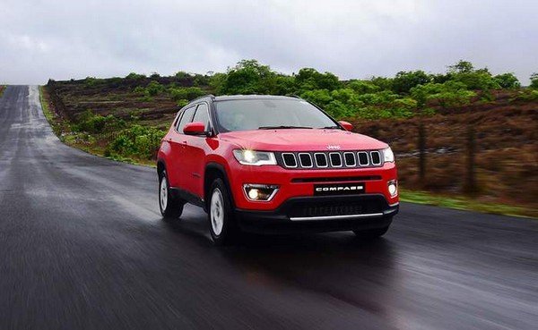 Jeep Compass red color on road