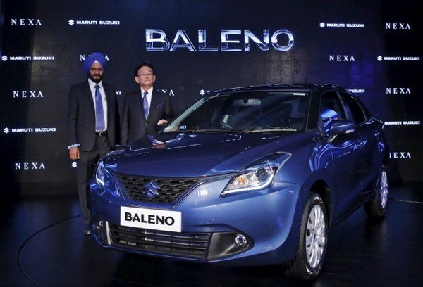 Maruti Baleno at show room with 2 man