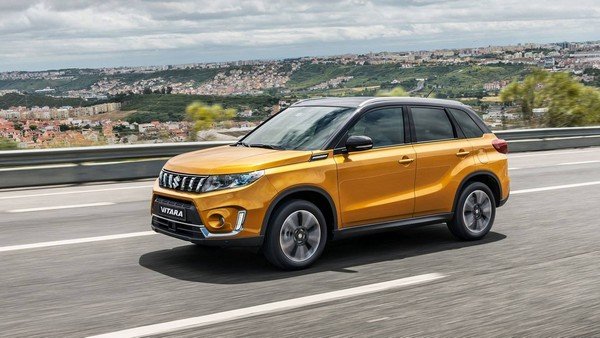 Suzuki Vitara orange color on road