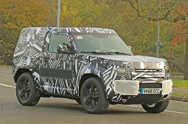 2020 Land Rover Defender under camouflage left side profile