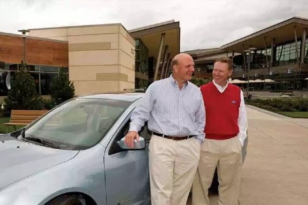 Steve Ballmer and his friend standing next to his car