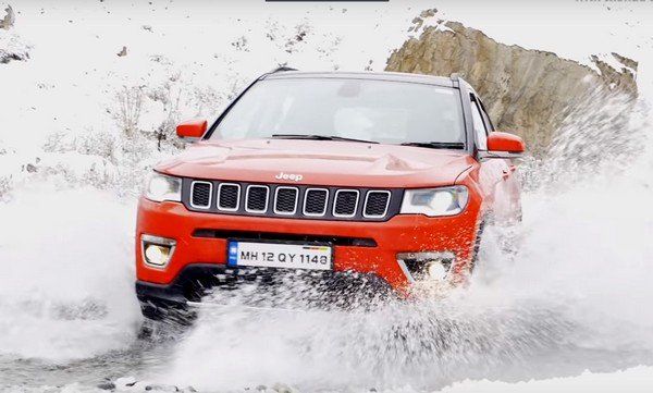 Jeep Compass red balck front on snow