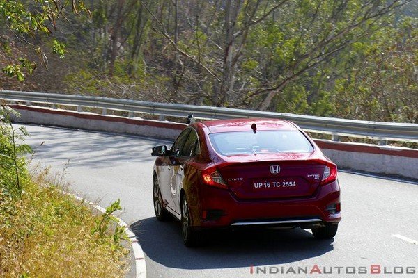 2019 honda civic red rear angle in action