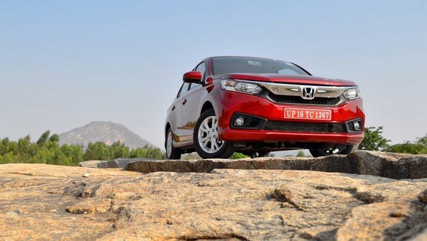 2018 honda amaze red front angle on the cliff