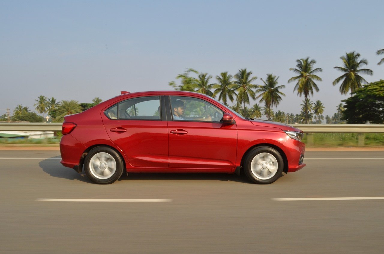 2018 Honda Amaze red side profile in action