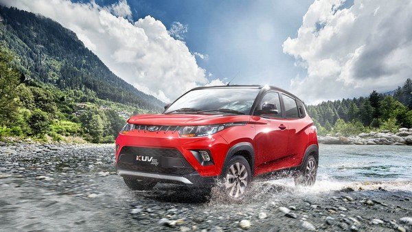 mahindra kuv100 red front three quarters left side