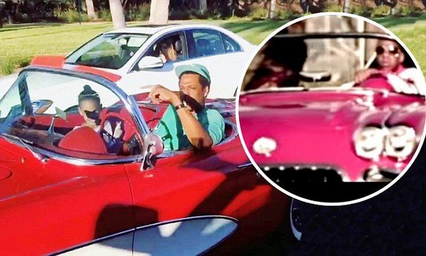 Jay-Z and Blue Ivy in red and white 1957 C1 Corvette