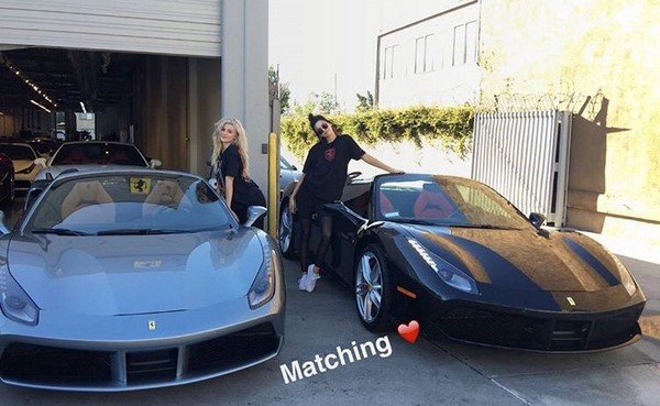 kylie and kendall posing with ferrari 488 spiders