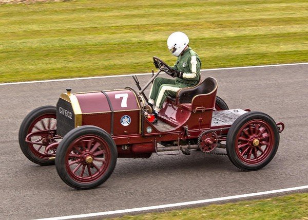 man driving red 1903 Mercedes 60hp