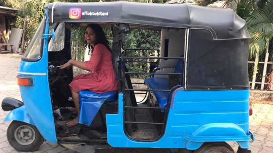Yashashri Masukar, aka TukTukRani driving in her blue Autorickshaw