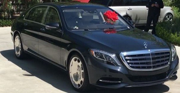 a black mercedes benz s600 wrapped up as a gift