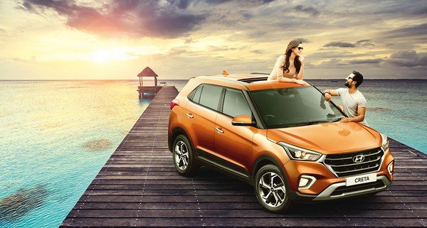 hyundai creta orange front three quarters right side