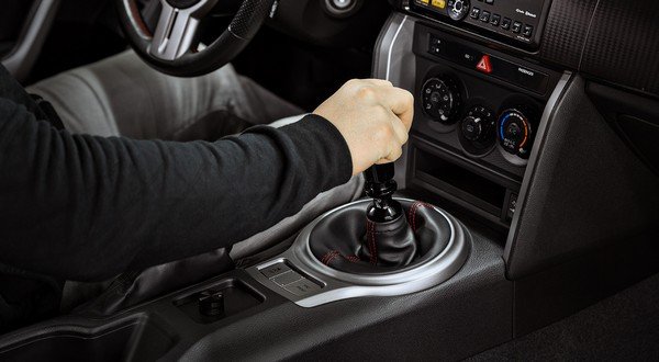putting hand in the gear knob