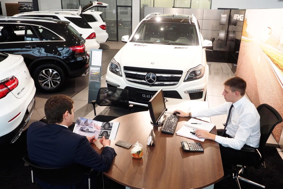 car salesmen at a table