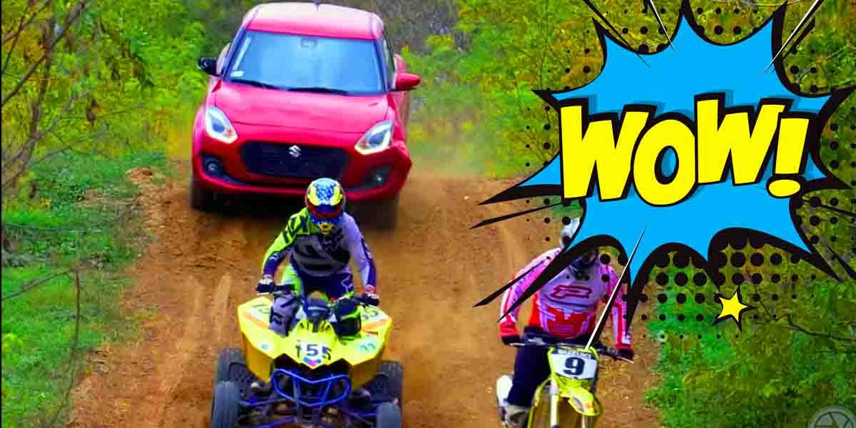 Suzuki Swift Racing With Dirt Bikes And ATV On Dirt Track
