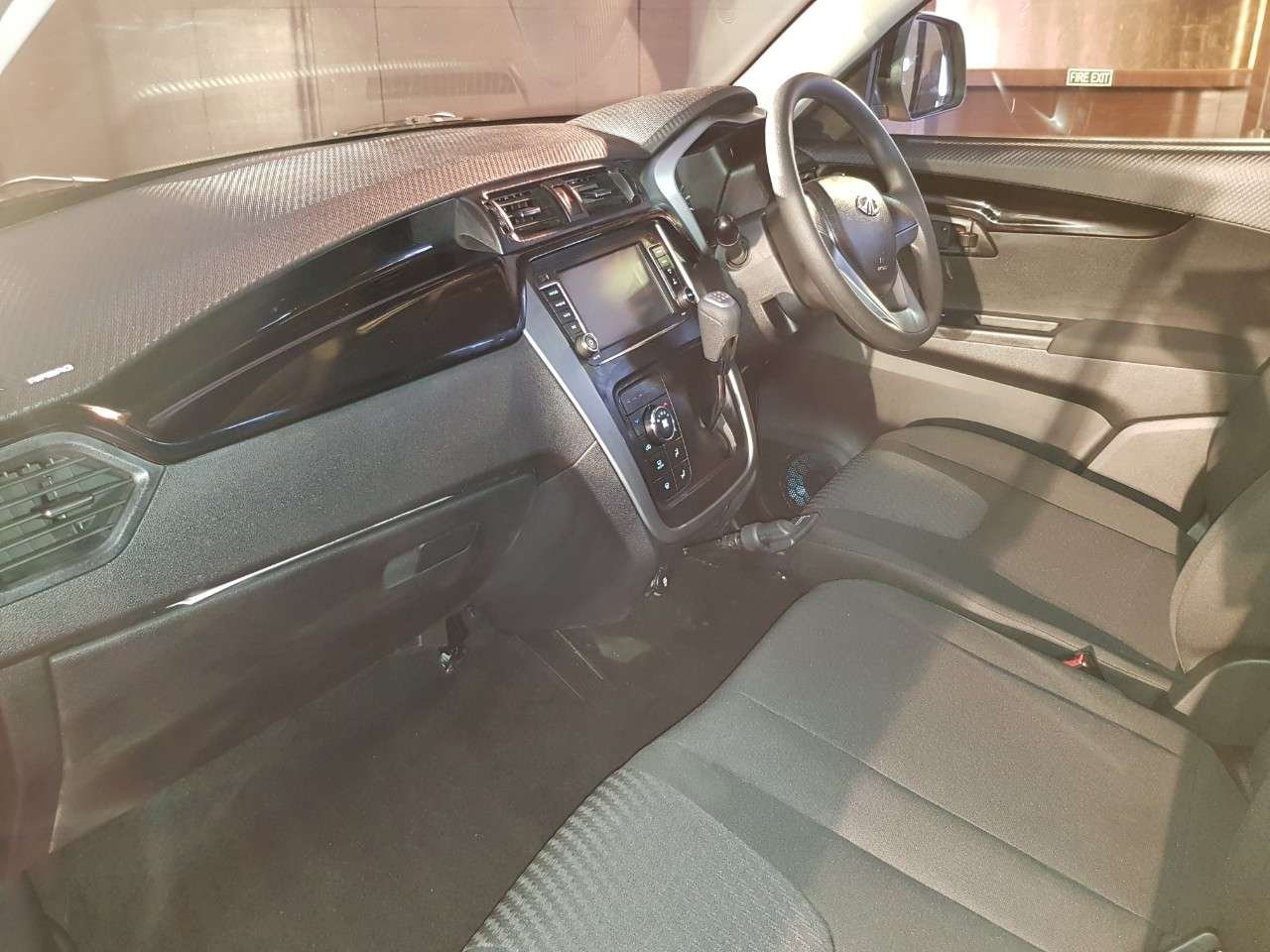 Mahindra KUV100 NXT interior dashboard side view