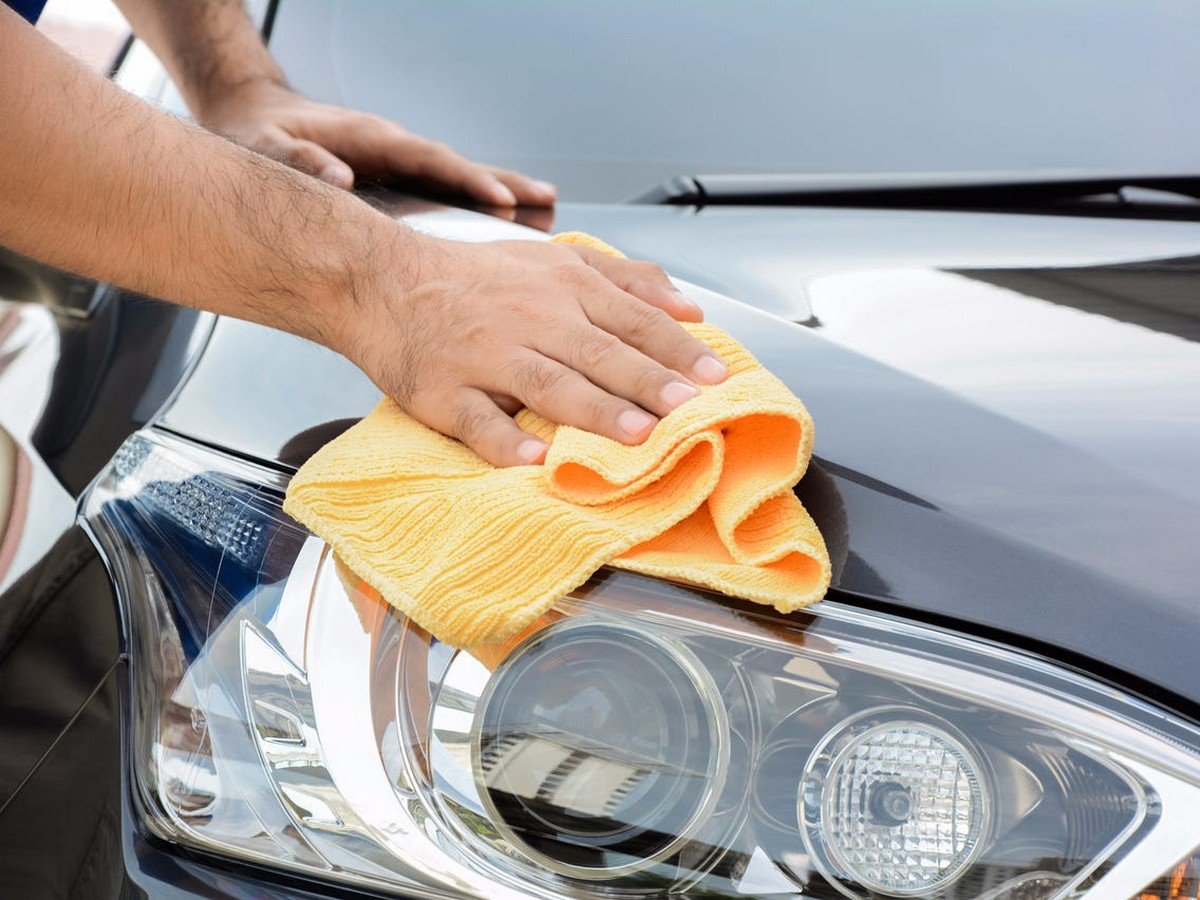 clean car hood with towel