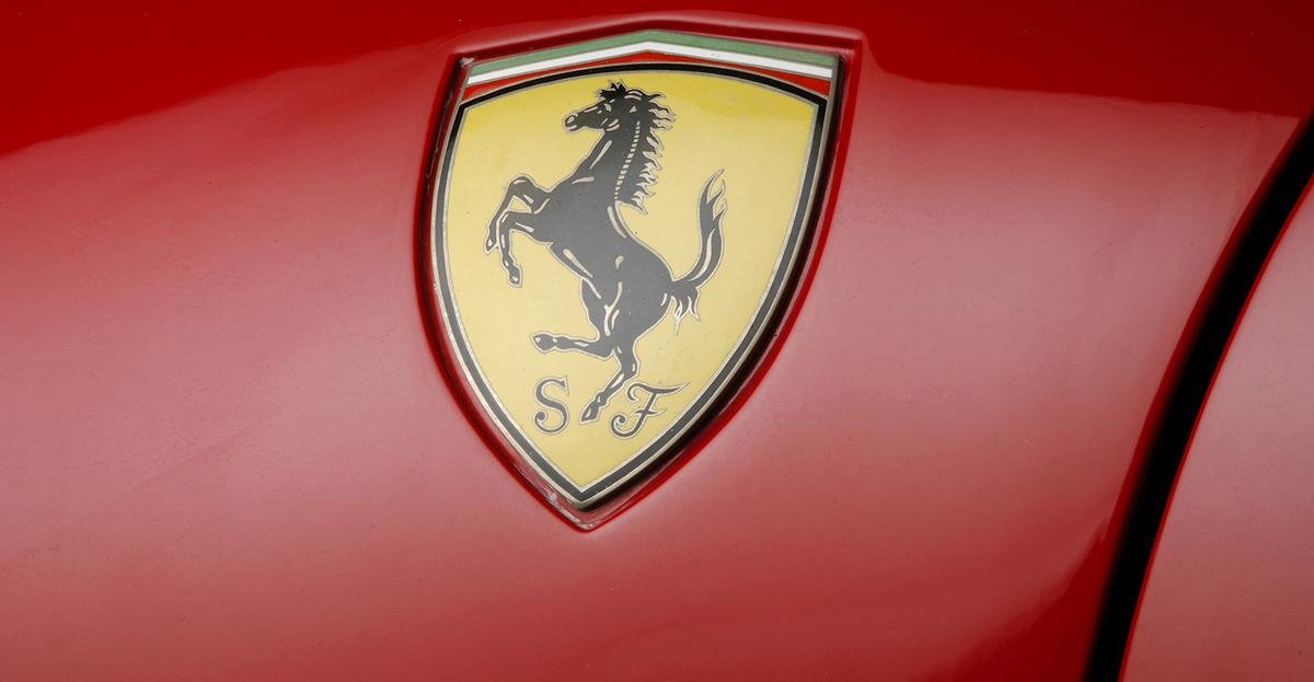 car logos with horse -ferrari badge red colour