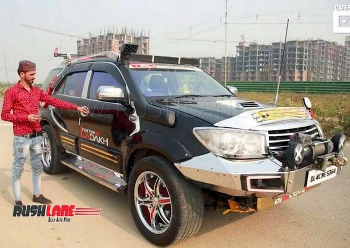 Dancing Toyota Fortuner beside the owner
