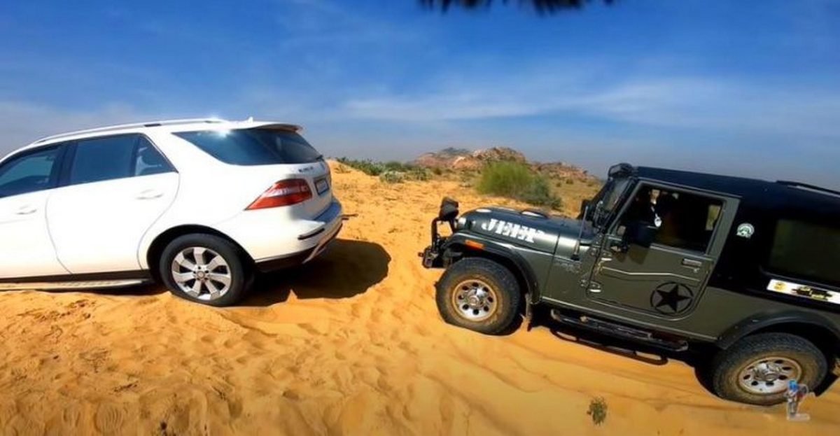 Side-look-of-Mercedes-SUV-and-Mahindra-Thar